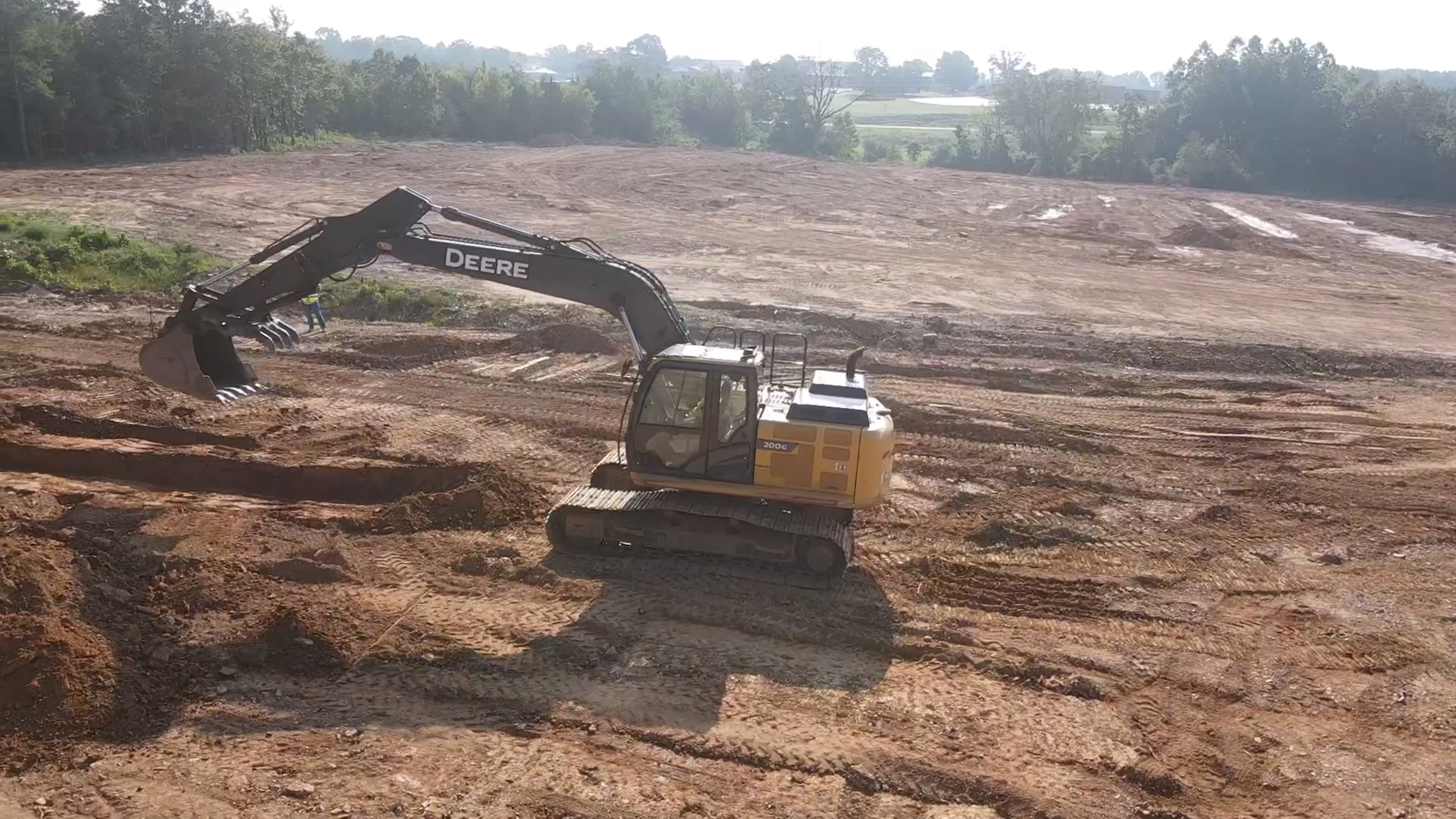 Excavator performing excavation and site work