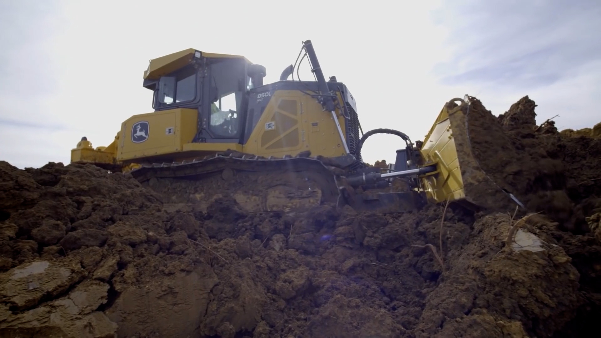 Bulldozer pushing soil during grading and site preparation